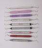 Fig 2. A variety of dental hygiene instruments demonstrates the trend away from small-diameter handles toward larger-diameter textured handles. From top to bottom, the instruments are: Premier scaler H6/H7, PremierAir™ scaler H6/H7, American Eagle EagleLite Resin scaler H5-33, American Eagle EagleLite Stainless H6-7, Hu-Friedy DE scaler H6/H7, Hu-Friedy DE scaler ResinEight® H6/H7, Hu-Friedy Nevi® Posterior EverEdge®, PDT R144 Queen of Hearts™, Nordent® DuraLite® ColorRIngs™ CESCN135.
